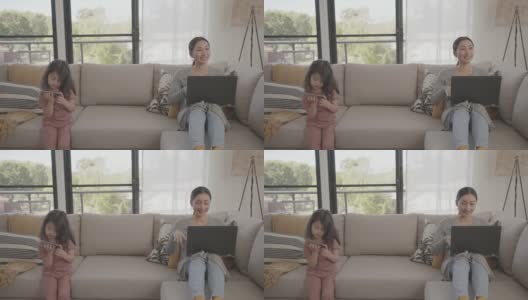 亚洲妇女在家工作带孩子，电子学习，成人学生班，在家上学，自由职业，新常态概念高清在线视频素材下载