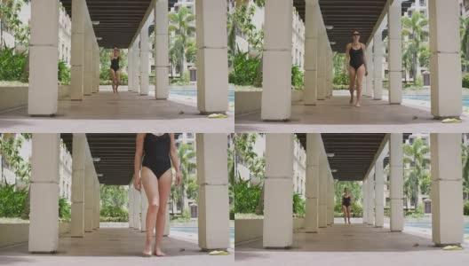 一个女人走在泳池边高清在线视频素材下载