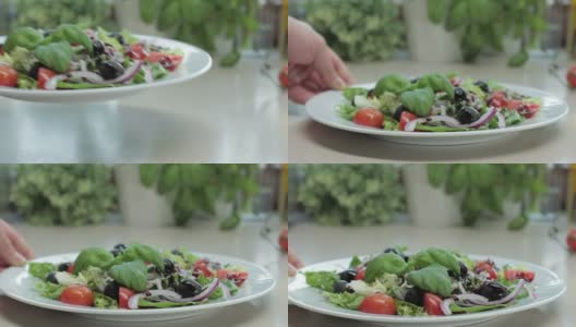 盛有新鲜蔬菜沙拉的盘子高清在线视频素材下载