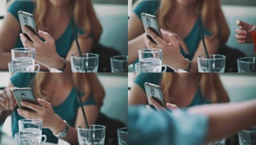 一名女子在咖啡馆里使用智能手机高清在线视频素材下载