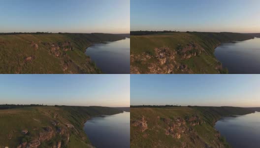 威严的无人机飞行通过乌克兰风景河Dnister。陡峭的岸边有石头。自然没有人。日落。FullHD高清在线视频素材下载