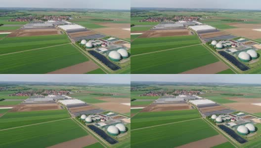 镜头从猪场的沼气厂上空飞过。生物质的可再生能源。现代农业欧盟。鸟瞰图，从空中俯瞰全景高清在线视频素材下载