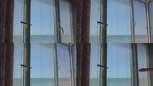 夏天从开着百叶窗的窗户眺望大海高清在线视频素材下载