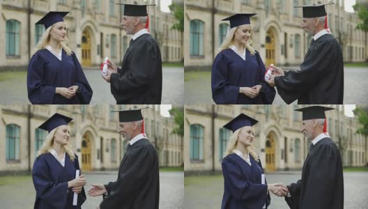 大学校长给学生颁发毕业证书，握手，毕业典礼高清在线视频素材下载
