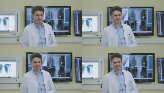 快乐成熟的医生站在医院的办公室里高清在线视频素材下载