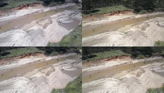 Flycam薄膜狭窄浑浊的河流用于提取砂砾高清在线视频素材下载