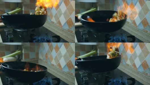 用燃烧的平底锅烹饪高清在线视频素材下载