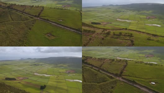 飞过绿色的山脊，进入有许多农田的山谷。亚述尔群岛，Terceira, Serra do Cumo的航拍高清在线视频素材下载