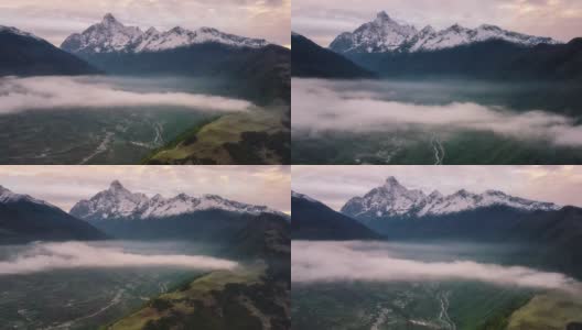 一朵云从四姑娘山前掠过高清在线视频素材下载