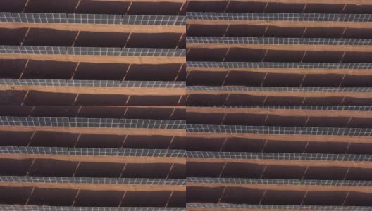 空中景观的太阳能电池板纹理作为光伏能源系统在沙漠的热量太阳。作为可再生能源的清洁能源系统的模式镜头。可持续的太阳能电池板农场效率绿色生态能源高清在线视频素材下载