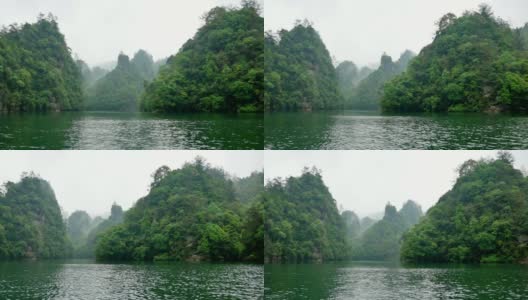 张家界山脉覆盖着热带森林，雾和雨高清在线视频素材下载