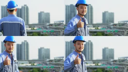幸福微笑亚洲工程的肖像在建筑工地的顶部。高清在线视频素材下载