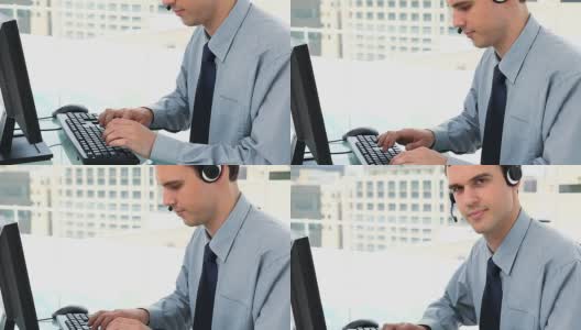 戴着耳机在键盘上打字的商人高清在线视频素材下载