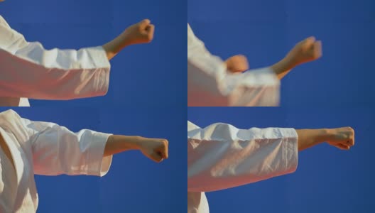 身穿和服的男子的拳头慢慢挥拳来展示空手道技术高清在线视频素材下载