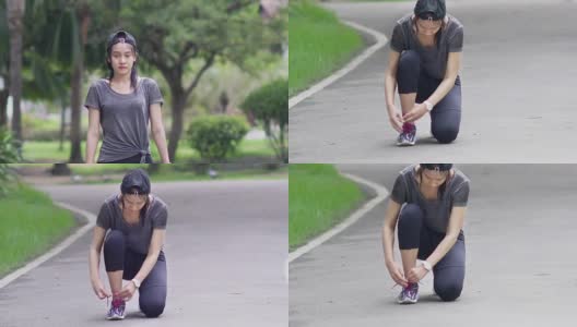 在训练前系鞋带的亚洲女子高清在线视频素材下载