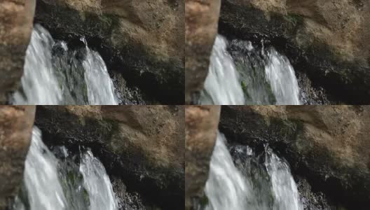 从岩石和石头中流出的泉水高清在线视频素材下载