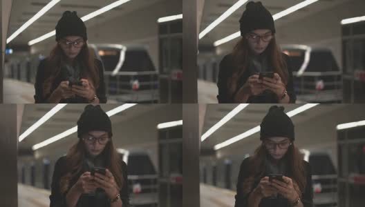 一位年轻女士在地铁里用手机高清在线视频素材下载