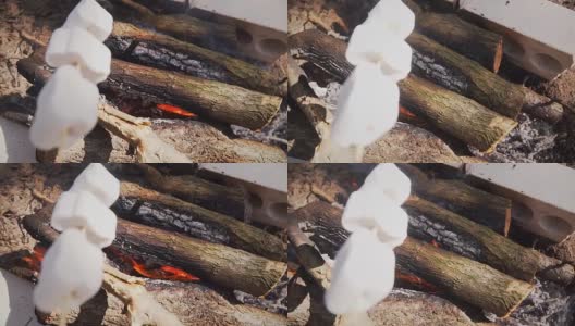 棉花糖棍在火中的慢动作高清在线视频素材下载