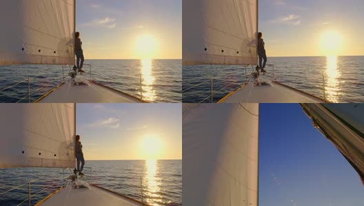 日落时从桅杆到帆船上的一个女人高清在线视频素材下载