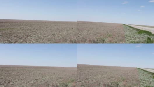 在俄罗斯卡尔梅克共和国的蓝天下，沙漠草原高清在线视频素材下载
