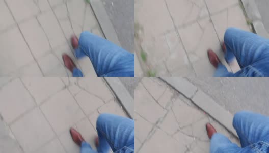从上往下看，男人的腿走在人行道上高清在线视频素材下载
