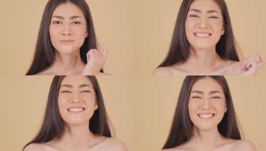 美丽的亚洲女人的肖像看着相机迷人的微笑。具有美容护肤理念的人。高清在线视频素材下载
