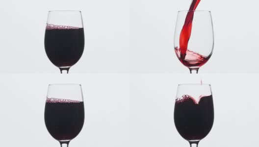葡萄酒。红酒倒入酒杯中，背景为白色。中心组成。高清在线视频素材下载