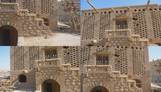 中国新疆吐鲁番葡萄谷的古老传统葡萄风干房屋建筑。高清在线视频素材下载