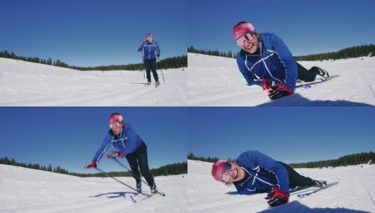 慢动作镜头的一个年轻女子在她的二十多岁的越野滑雪，摔倒在雪地上，并笑着看着相机高清在线视频素材下载