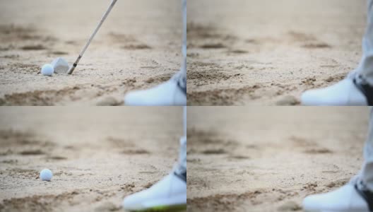 一位亚洲的中国资深高尔夫球手用他的铁棒在沙坑里打他的高尔夫球高清在线视频素材下载