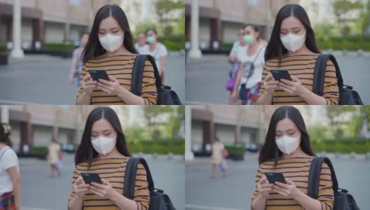 在城市里使用智能手机的亚洲女性高清在线视频素材下载