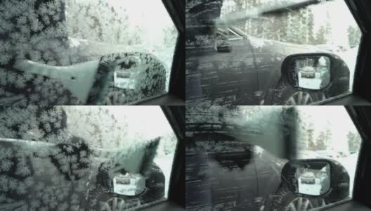 年轻女子用雪刷刮冰从车窗高清在线视频素材下载