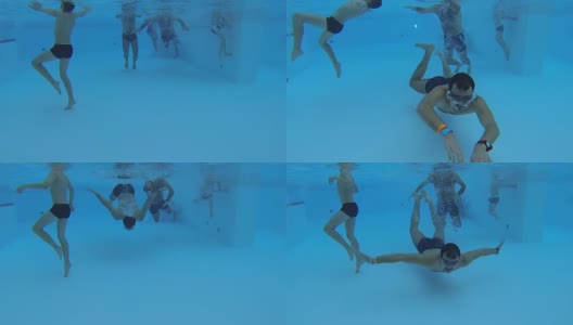 游泳池里的人群被水下摄像机拍摄到，一个人正朝它移动高清在线视频素材下载