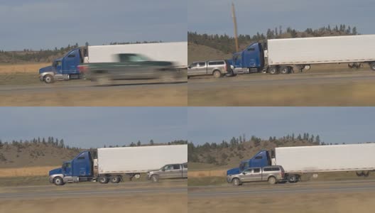 近距离观察:一辆皮卡在州际公路上超越蓝色半挂车高清在线视频素材下载