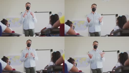 白人男老师戴着口罩在学校上课高清在线视频素材下载
