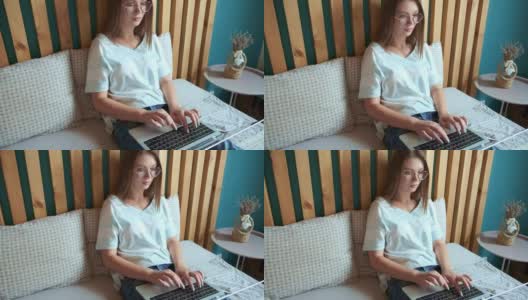 年轻女子用笔记本电脑快速敲击键盘工作，躺在卧室的床上，灵活的时间和远程工作。高清在线视频素材下载