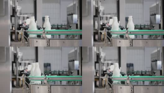 牛奶公司生产线上牛奶瓶的镜头高清在线视频素材下载