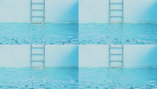 游泳池的蓝色水纹理背景与不锈钢楼梯高清在线视频素材下载