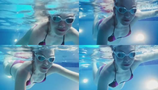 年轻孕妇在水下游泳高清在线视频素材下载