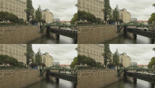 在奥地利维也纳，地铁列车行驶在横跨多瑙河的一座桥上高清在线视频素材下载
