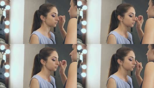 年轻漂亮的女人正在化妆高清在线视频素材下载