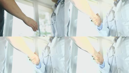 医生与男病人握手高清在线视频素材下载