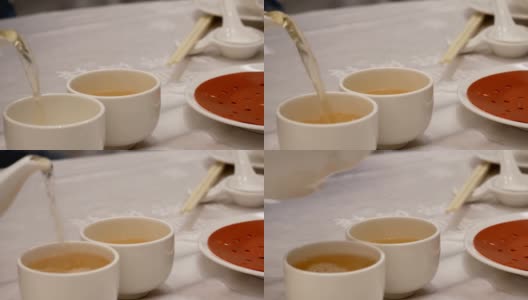 中国餐馆里人们倒热茶的动作高清在线视频素材下载