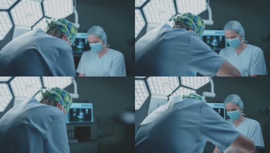 女性护士在ICU协助男性外科医生高清在线视频素材下载