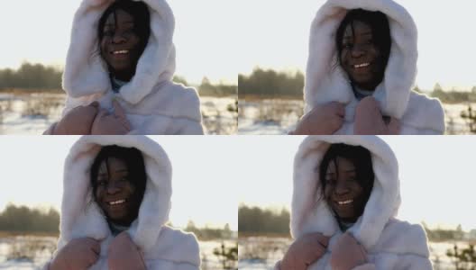 非裔美国妇女在冬季拍照时摆出微笑的姿势高清在线视频素材下载