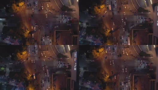 黄昏夜晚，照亮了青岛市区交通街道十字路口高空俯视图4k中国高清在线视频素材下载