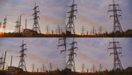 日落时分的高压电塔。傍晚天空背景上的现场传输线。电力分布。视图从下面。高清在线视频素材下载