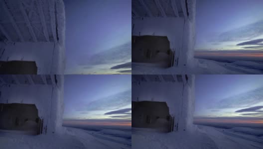 冬天的风景。垂直全景，冰雪覆盖的建筑。北部冰雪覆盖的冬季山脉，希比尼高清在线视频素材下载