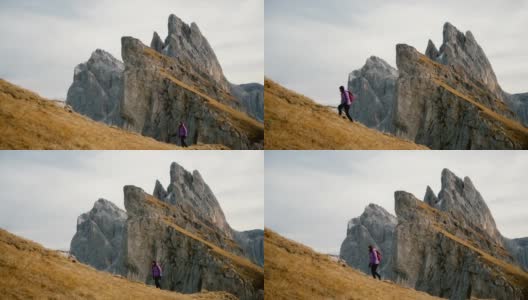 在Dolomites的Seceda山附近徒步旅行的妇女高清在线视频素材下载