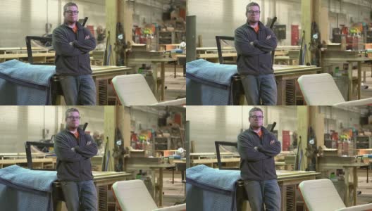 一个自豪的木工老板站在他的店里高清在线视频素材下载